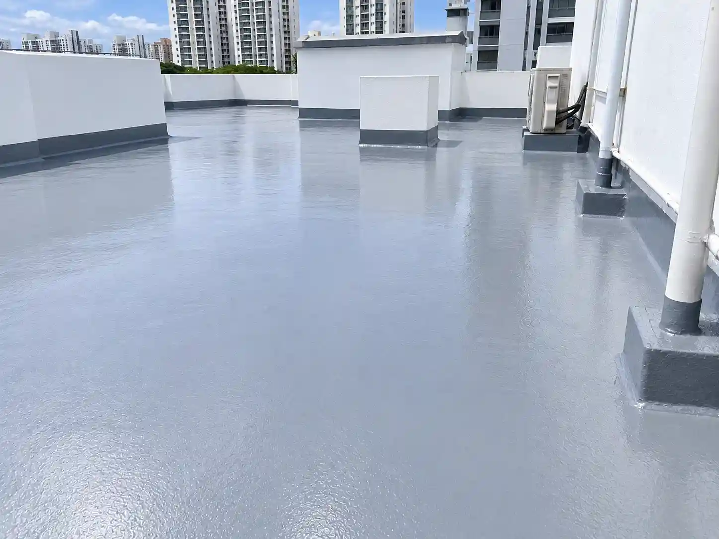Restored concrete roof with seamless waterproof coating