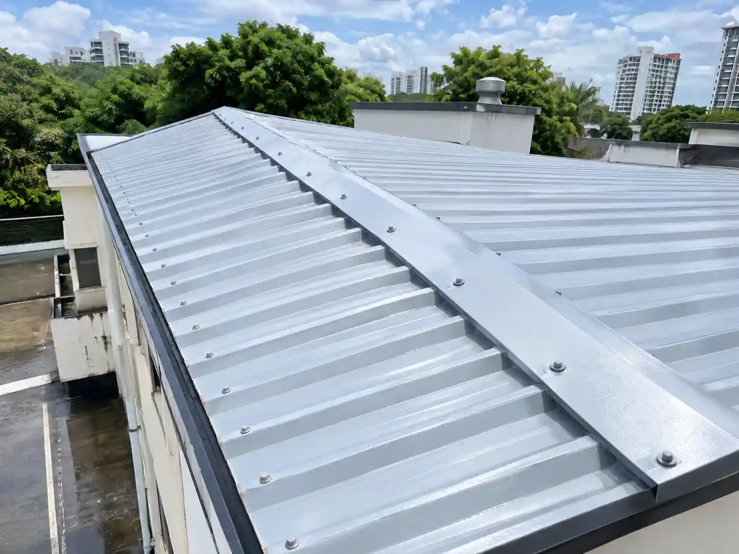 Sealed and coated metal roof joints after waterproofing