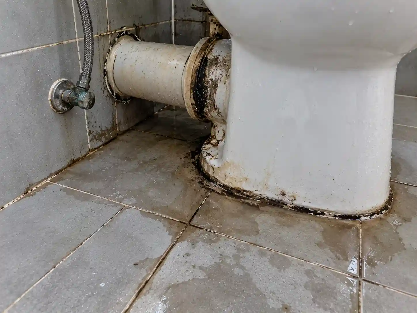 Lower floor toilet ceiling water stain before repair