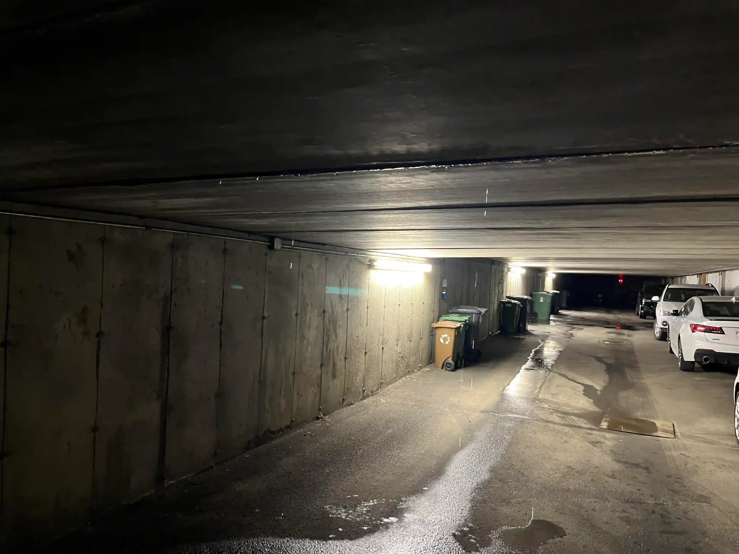 Active concrete crack leak before repair